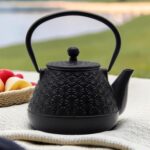 20.3oz Small Cast Iron Teapot, SECHUDO Tea Kettle for Stovetop Safe Coated with Enameled Interior, Japanese Style Tea Pot with Stainless Steel Infuser for Loose Tea (Black Gerbera Pattern) - Image 4